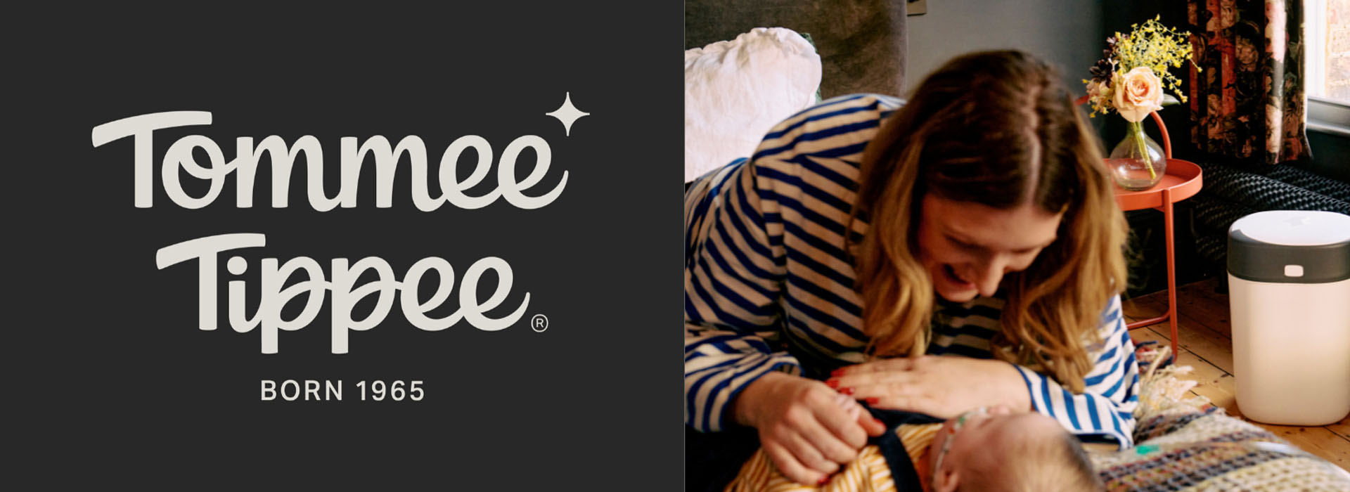 Tommee Tippee logo og kvinde med baby i stribet trøje.